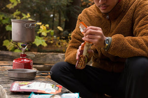 camper cooking a meal